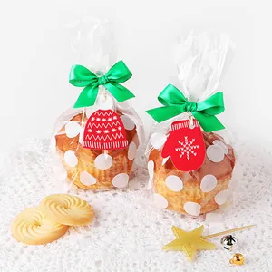 Christmas gift packaging set with muffin bags, green ribbons and red glove gift tags