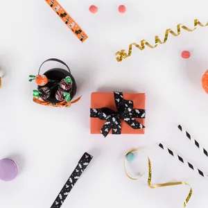 Halloween orange gift box with black bat pumpkin printed satin ribbon for festive wrapping