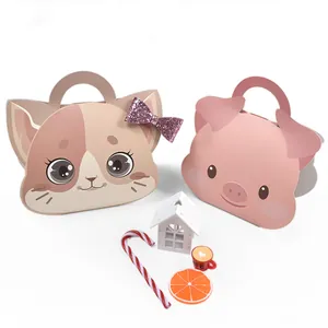Detail of folding animal paper gift boxes with pink sequin bow and cute cartoon handles