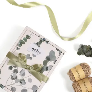 Elegant floral gift box with eucalyptus pattern and olive green satin ribbon bow for tea