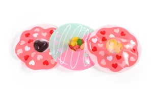Three donut-shaped resealable gift bags with heart patterns and clear display windows