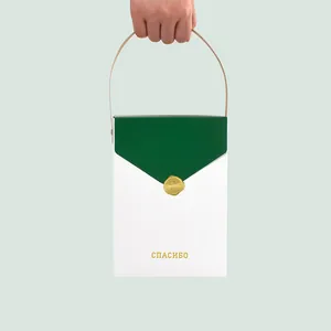 Minimalist gift bag with green flap, gold seal, Russian 'СПАСИБО' text and handle