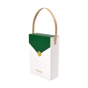 Elegant green and white gift box with wood texture handle and gold foil lettering