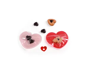 Detail of pink heart-shaped self-sealing gift bags for candy with sweet text prints