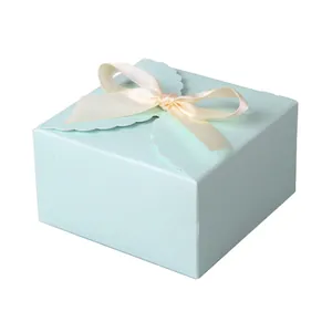 Elegant mint blue square gift box with scallop edge and cream satin ribbon bow