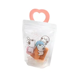 Bolsa de regalo con asa de corazón rosa, dibujos animados y ventana transparente
