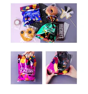 Detail showing metallic Happy Birthday gift bags with colorful party illustrations
