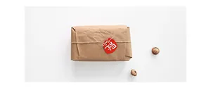 Detail of red Chinese New Year Fu character tag on kraft gift box with jute twine