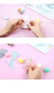 Detail eines DIY Katzen-Geburtstagsbanners mit Papiermotiven und bunten Wollkugeln