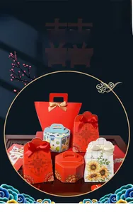 Detailed collection of elegant Chinese wedding favor boxes with ribbons on a wooden table