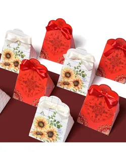 Detail of red and white wedding candy boxes with Chinese double joy symbol and ribbon