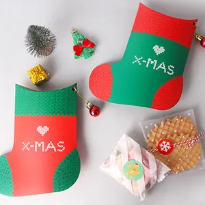 Christmas stocking shaped gift boxes with festive red and green colors for candy packaging