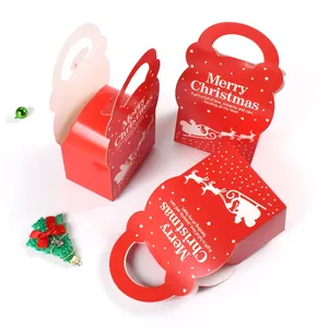 Red Christmas paper gift boxes with Merry Christmas print and reindeer sleigh silhouettes