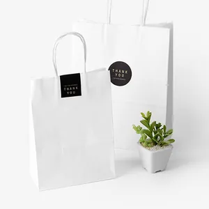 Sacs-cadeaux en papier kraft blanc avec poignées et autocollants de remerciement dorés