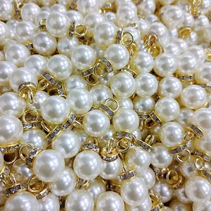 Close-up of pearl charms with gold rhinestone buckles for wedding candy box decorations