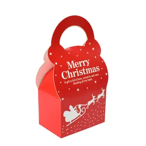 Red Christmas gift box with reindeer sleigh design and white Merry Christmas greeting