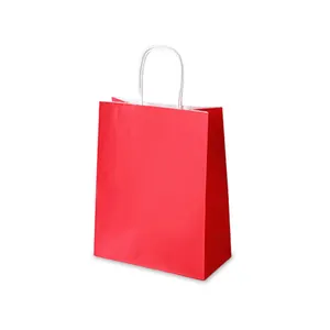 Classic red paper gift bag with sturdy white woven handles and serrated top edge design