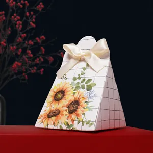 Elegant triangular wedding candy box with sunflower patterns and a white silk bow