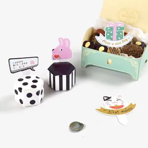Creative cartoon rainbow gift boxes and cupcake topper cards for festive DIY baking decor