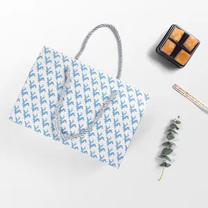 Scatola regalo minimalista azzurra con motivo pixel e manici per torte e biscotti