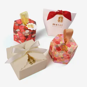 Wedding candy gift boxes with elegant silk ribbons and gold double happiness metal charms