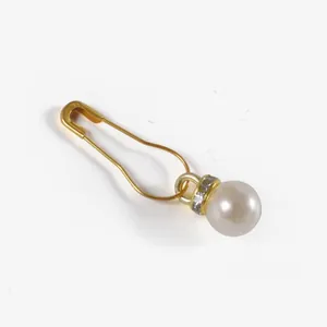 Elegant gold safety pin brooch with sparkling zircon ring and white pearl pendant