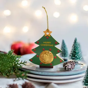 Christmas tree shaped gift card with gold string and a round candy window for holiday decor