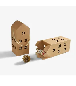 Macro view of house-shaped kraft paper gift box with hollow windows and soft rope handle