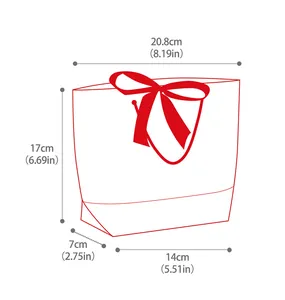 Detailed dimension guide for white trapezoid gift bag with red ribbon handle bow