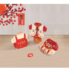 Close-up of Tang suit style candy boxes with red tassels and Chinese greeting prints