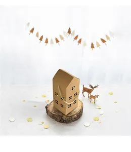 Detail of house-shaped kraft gift box with jute handle and hollow window on wood base