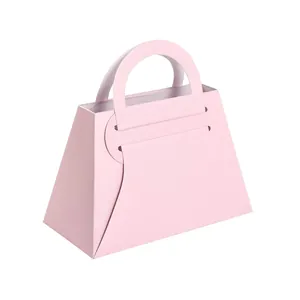 Elegante caja de dulces rosa con forma de bolso y asa para bodas y embalaje de regalos