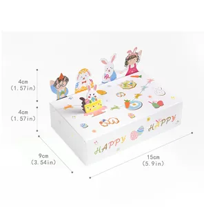 Vue détaillée d'une boîte cadeau de Pâques blanche avec dimensions 15cm x 9cm x 4cm inclus