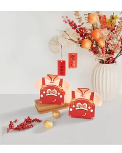 Chinese New Year Tang suit candy box with lion dance motif and traditional tassels
