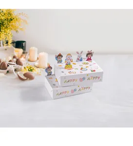 Détails de boîtes cadeaux de Pâques avec des personnages 3D et l'inscription Happy