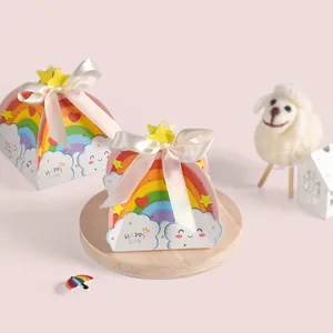 Rainbow triangle gift box with cream bow and clouds pattern for party favors