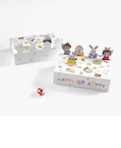 Détail de boîtes cadeaux 3D de Pâques avec motifs de lapins mignons et œufs colorés