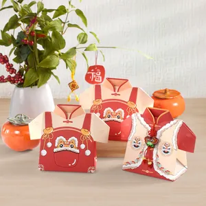 Festive red Tang suit style candy box with lion dance patterns for New Year gifts