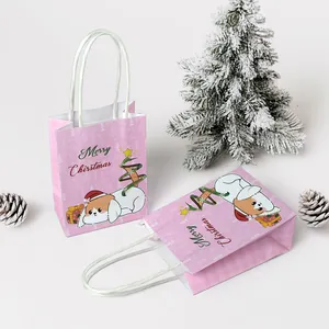 Pink Christmas gift bag featuring cute cartoon dog and white handles for holiday party