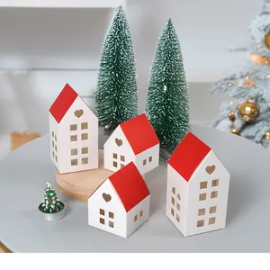 Detailed view of red-roofed white paper gift boxes with heart-shaped cutouts and windows