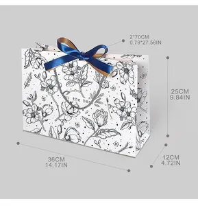 Detailed dimensions of a vintage floral gift bag with a navy blue silk bow tie
