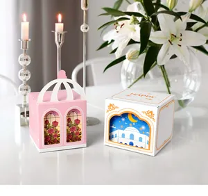 White gift boxes with 3D windows for candy, featuring floral and moon castle illustrations