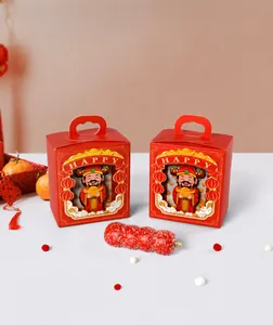 Detailed view of red Lunar New Year gift box with cartoon Caishen character design