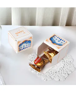 Detail view of white square gift box with festive window and Happy lettering print