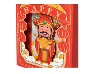 Detail of 3D layered paper candy box featuring festive God of Wealth with golden ingots