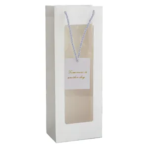 Vertical white paper gift bag with a large clear window and blue-white braided handles