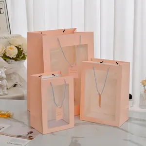 Pink minimalist gift bag set with transparent PVC window and woven handles in three sizes
