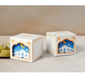 Detailed view of white 3D cutout gift boxes with Islamic mosque and crescent moon design
