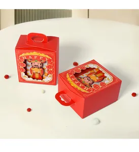 Detail of red New Year candy boxes with 3D Fortune God and golden HAPPY handle