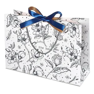 Vintage floral gift bag with all the best greeting and blue satin ribbon bow
